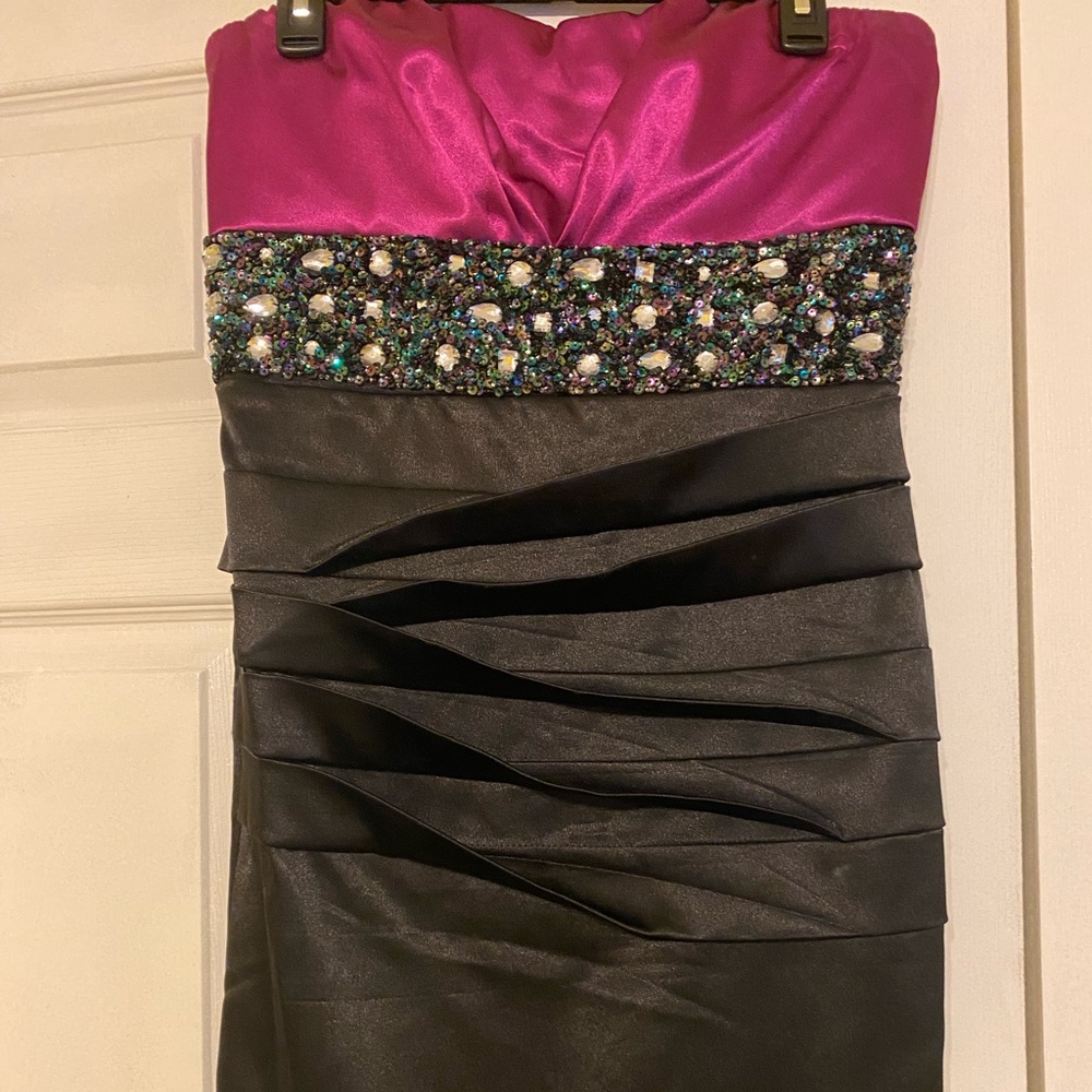 Beautiful strapless dress with sequence on front.  Only worn once